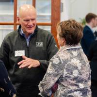 Guests mingle before the dinner